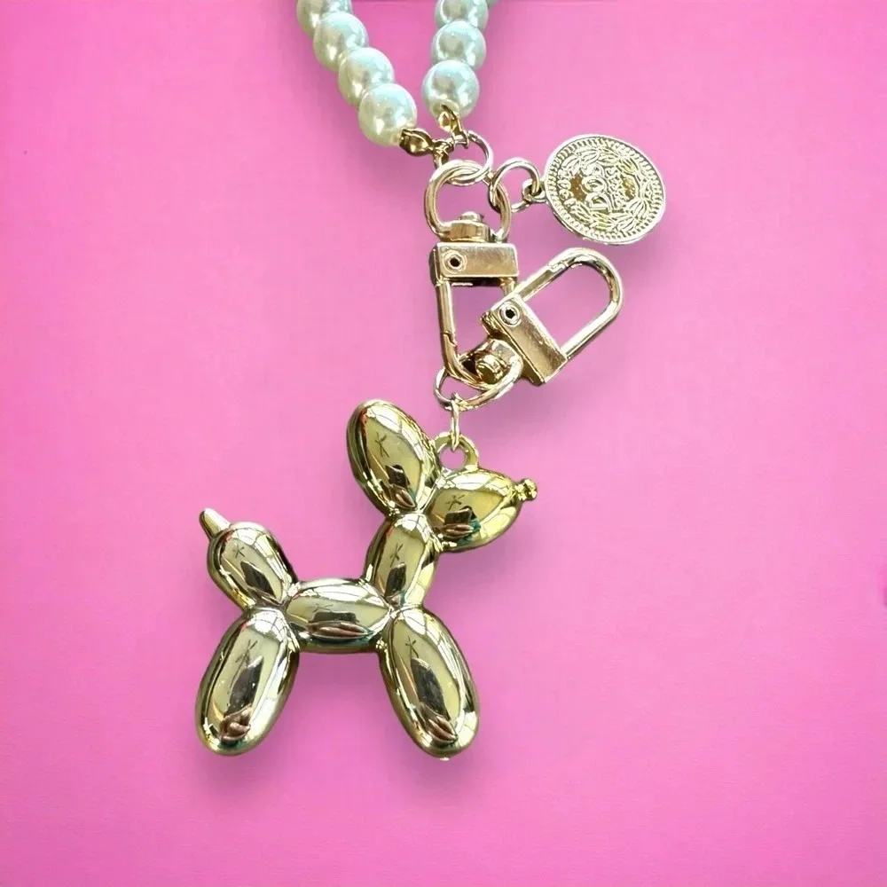 Balloon dog gold keychain with‎ pearl accent